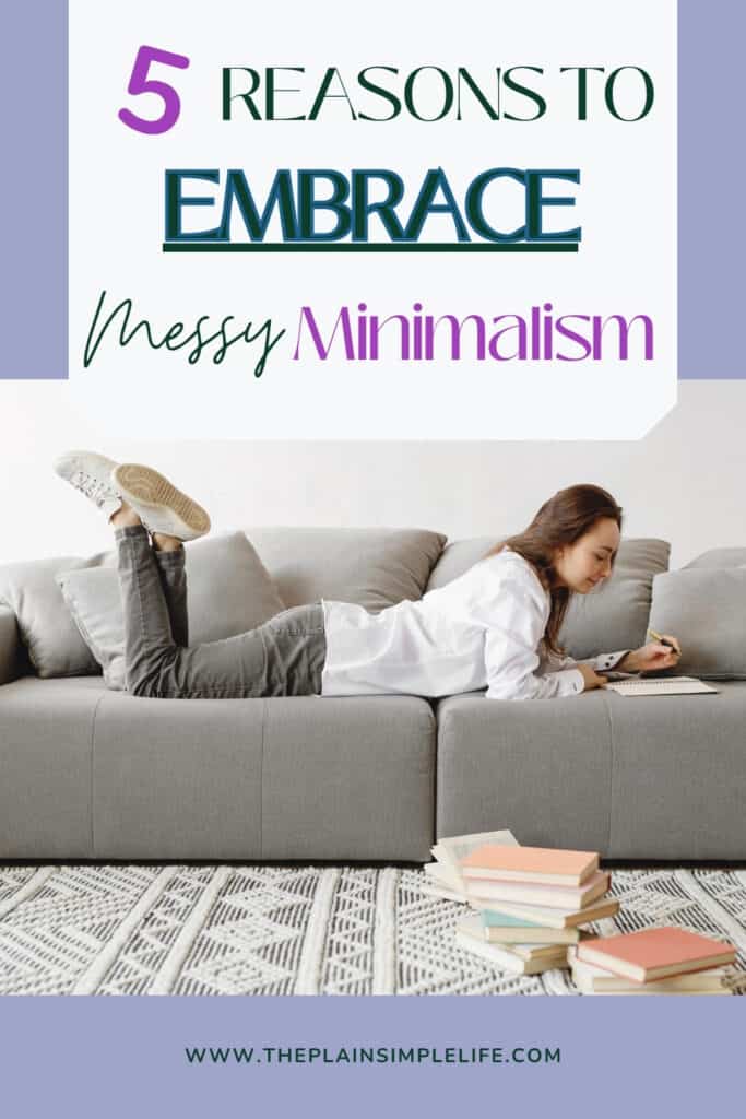 Pinterest pin titled “5 Reasons to Embrace Messy Minimalism” featuring a woman lying on a gray couch, writing in a notebook, with scattered books on a patterned rug below. The image visually represents a relaxed, imperfect approach to minimalism, blending calm organization with cozy clutter.